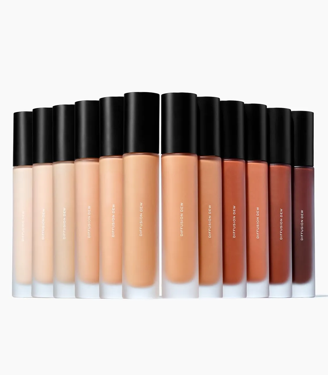 MAKE Beauty Diffusion Dew Skin Tint. Sheer to Medium Coverage Radiant Finish. Blurring, Smoothing, and Brightening for Glowing Complexion. Enhanced with Niacinamide and Adenosine. Amber 10