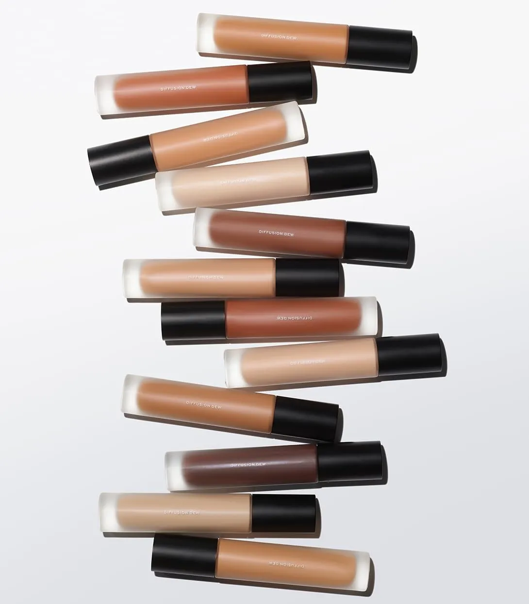 MAKE Beauty Diffusion Dew Skin Tint. Sheer to Medium Coverage Radiant Finish. Blurring, Smoothing, and Brightening for Glowing Complexion. Enhanced with Niacinamide and Adenosine. Amber 10